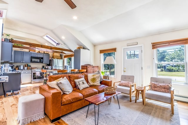 living room featuring baseboard heating, light wood-type flooring, ceiling fan, and vaulted ceiling