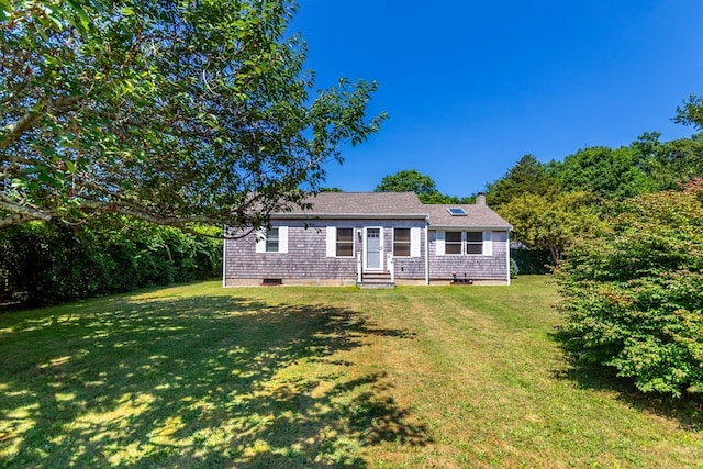 single story home featuring a front yard