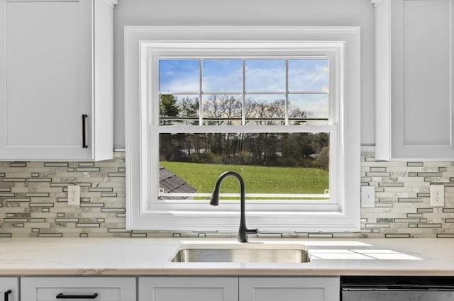 312 Old Westport, Dartmouth, MA 02747 - kitchen with white cabinets, backsplash, and dishwashing machine