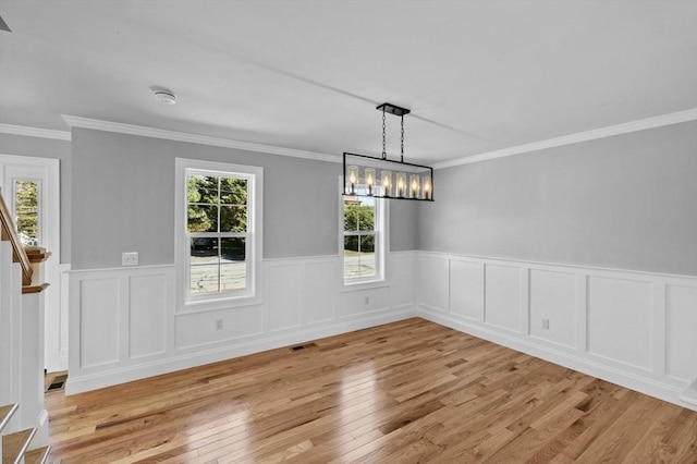 312 Old Westport, Dartmouth, MA 02747 - unfurnished dining area with light wood-style flooring, wainscoting, and ornamental molding