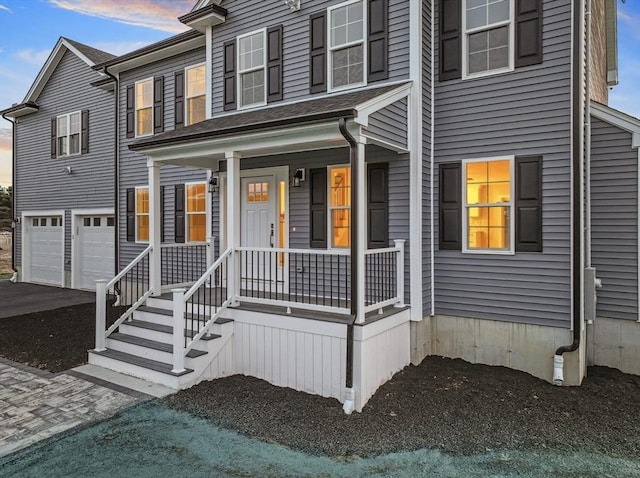 312 Old Westport, Dartmouth, MA 02747 - view of property with an attached garage, driveway, and a porch