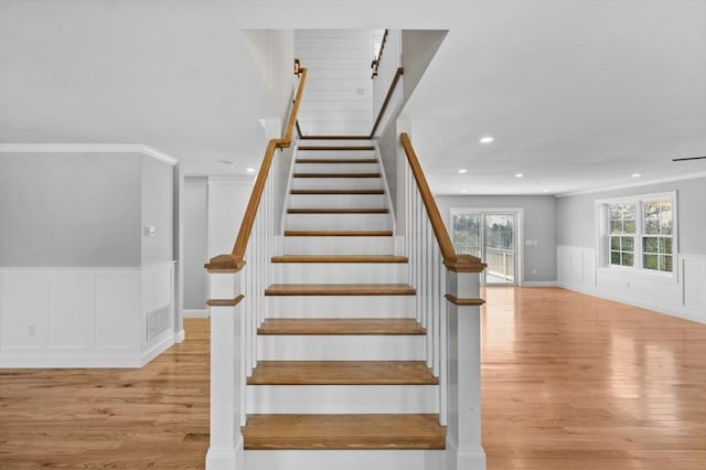 312 Old Westport, Dartmouth, MA 02747 - stairs featuring wood finished floors, a wainscoted wall, recessed lighting, a decorative wall, and ornamental molding