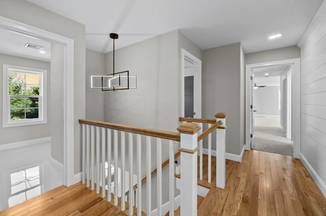 312 Old Westport, Dartmouth, MA 02747 - hall with an upstairs landing, wood finished floors, and baseboards