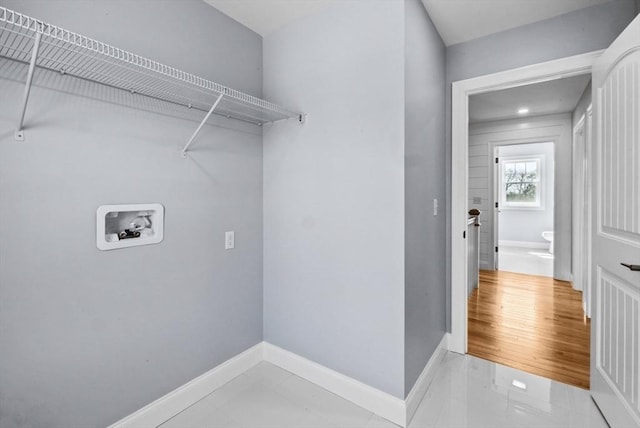 312 Old Westport, Dartmouth, MA 02747 - laundry area with washer hookup, baseboards, and light marble finish floors