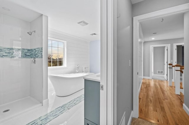 312 Old Westport, Dartmouth, MA 02747 - full bathroom with a soaking tub, a tile shower, vanity, and baseboards