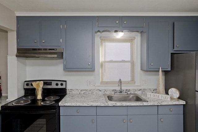 kitchen featuring stainless steel refrigerator, sink, and black range with electric cooktop