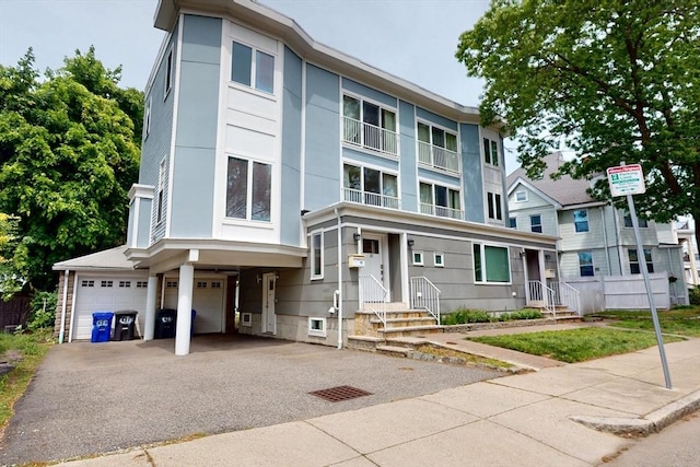 10 Bradbury St Unit 10, Boston, MA 02134 - view of front of property with a garage and driveway