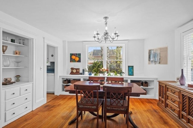 52 Locust St, Lynn, MA 01904 - dining space with light wood-style floors and a chandelier