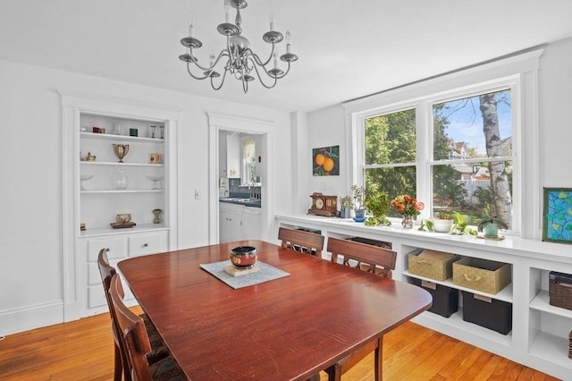 52 Locust St, Lynn, MA 01904 - dining space featuring light wood-style floors and a chandelier