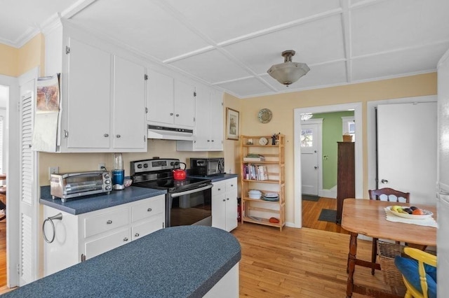52 Locust St, Lynn, MA 01904 - kitchen featuring electric range, a toaster, dark countertops, under cabinet range hood, and light wood finished floors