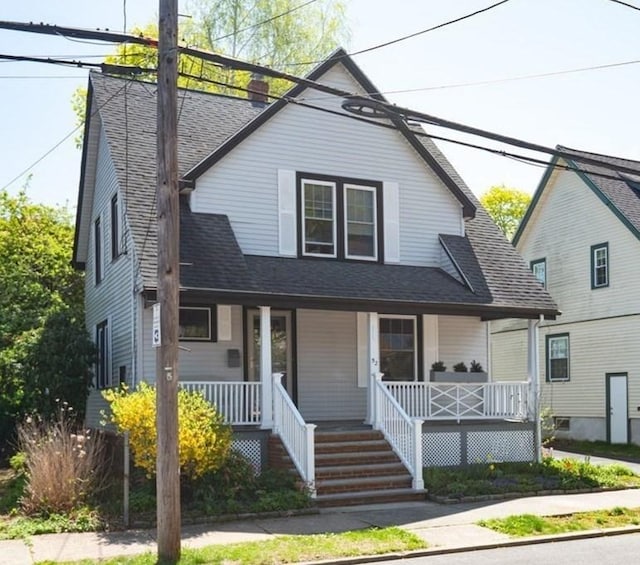 52 Locust St, Lynn, MA 01904 - view of front of house with a shingled roof and a porch