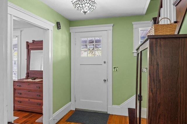 52 Locust St, Lynn, MA 01904 - doorway with baseboards, plenty of natural light, and wood finished floors