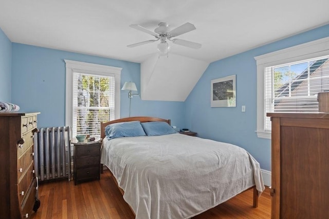 52 Locust St, Lynn, MA 01904 - bedroom with multiple windows, wood finished floors, and radiator