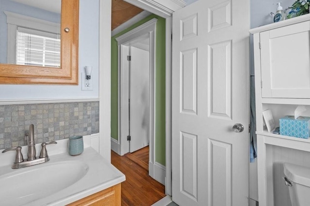 52 Locust St, Lynn, MA 01904 - bathroom with vanity, wood finished floors, and tasteful backsplash