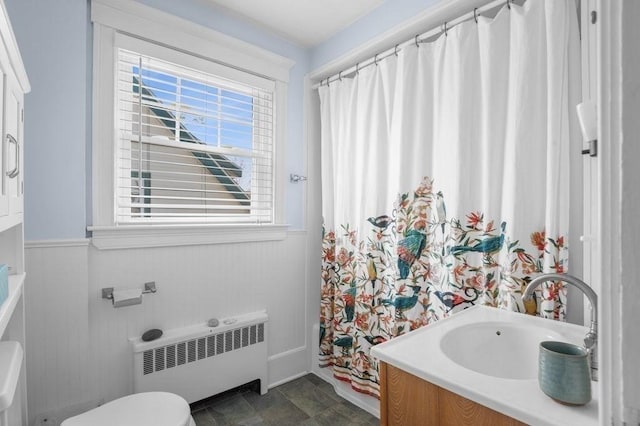 52 Locust St, Lynn, MA 01904 - full bath featuring plenty of natural light, radiator heating unit, toilet, and curtained shower