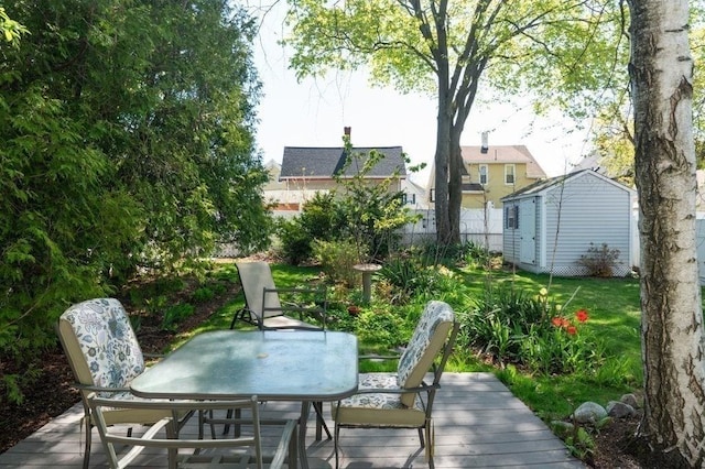 52 Locust St, Lynn, MA 01904 - exterior space with an outbuilding, fence, a storage shed, and outdoor dining space