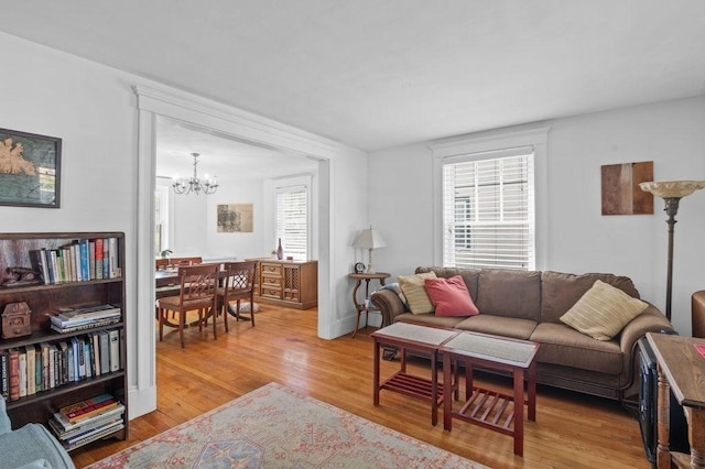 52 Locust St, Lynn, MA 01904 - living room with a chandelier and light wood-style flooring
