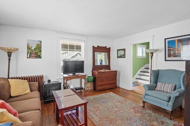 52 Locust St, Lynn, MA 01904 - living area with stairs, wood finished floors, and a wood stove