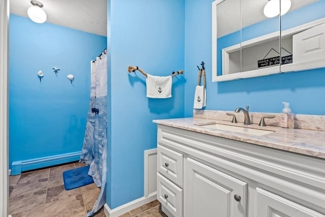 bathroom featuring vanity, a shower with curtain, and baseboard heating