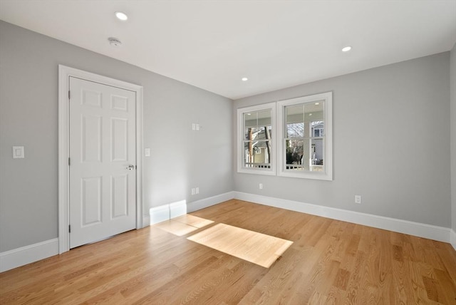 empty room with light hardwood / wood-style floors