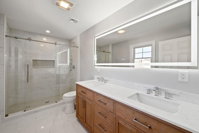 bathroom featuring toilet, an enclosed shower, and vanity