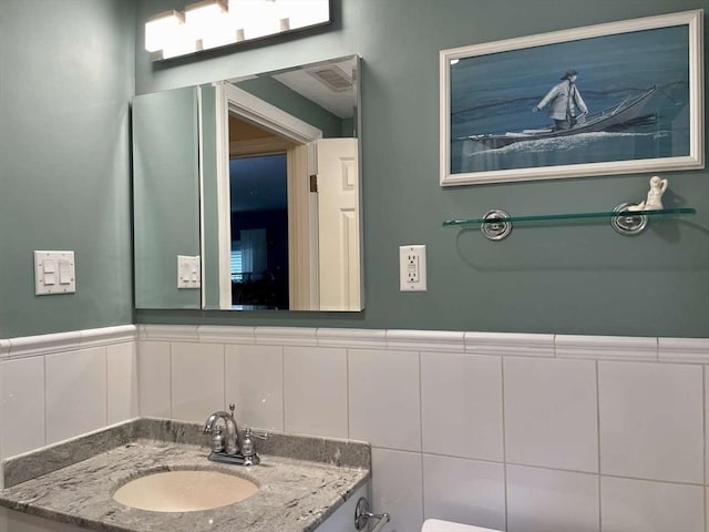 4 Hickory Ln, North Reading, MA 01864 - bathroom with vanity and a wainscoted wall