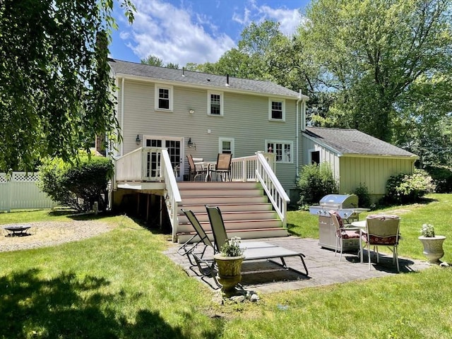 4 Hickory Ln, North Reading, MA 01864 - rear view of house featuring an outdoor fire pit, stairway, a deck, and a patio