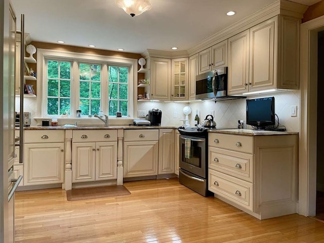 4 Hickory Ln, North Reading, MA 01864 - kitchen with appliances with stainless steel finishes, open shelves, light wood finished floors, cream cabinets, and recessed lighting