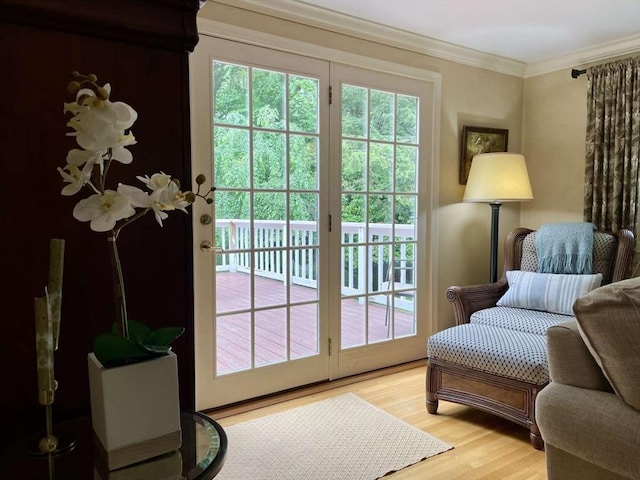 4 Hickory Ln, North Reading, MA 01864 - doorway to outside featuring light wood finished floors and crown molding