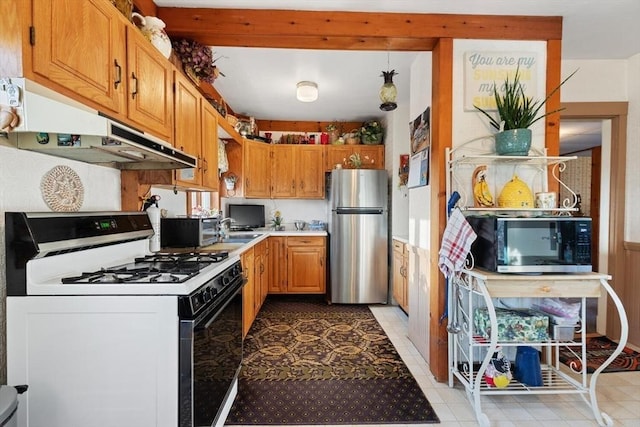 kitchen featuring light tile patterned flooring and appliances with stainless steel finishes