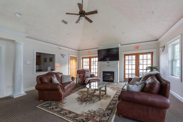 170 Beach Rd Unit 41, Salisbury, MA 01952 - carpeted living area featuring vaulted ceiling, plenty of natural light, ceiling fan, ornate columns, and a glass covered fireplace
