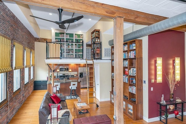 living area featuring recessed lighting, ceiling fan, and light wood-style floors