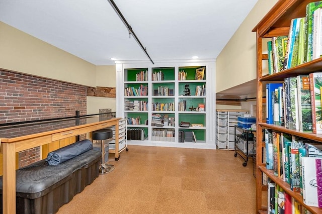 sitting room with tile patterned floors and built in shelves