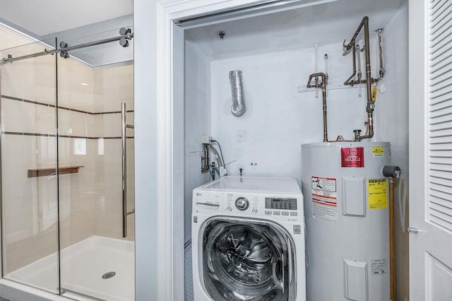 laundry area with laundry area, washer / clothes dryer, and water heater