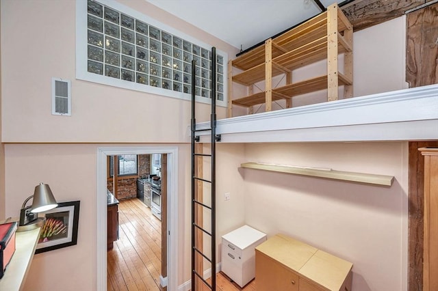 details with visible vents and wood finished floors
