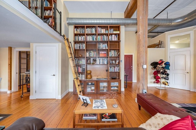living room featuring baseboards and hardwood / wood-style floors
