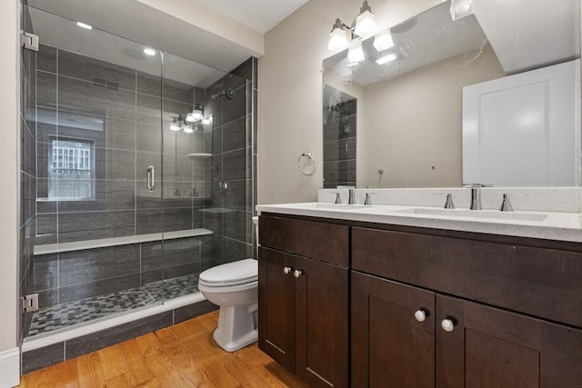 20 Winfield St Unit 1, Boston, MA 02127 - full bath featuring double vanity, a shower stall, and wood finished floors