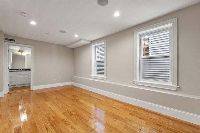 20 Winfield St Unit 1, Boston, MA 02127 - unfurnished room featuring light wood finished floors, a smoke detector, and recessed lighting