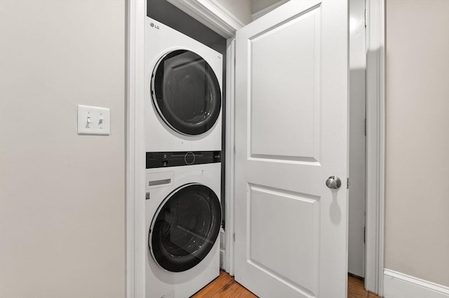 20 Winfield St Unit 1, Boston, MA 02127 - laundry room featuring stacked washer / dryer and light wood-style floors