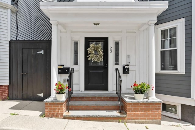 20 Winfield St Unit 1, Boston, MA 02127 - view of exterior entry featuring board and batten siding and covered porch