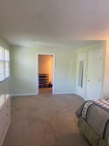 19 Camelot Ct Unit 19, Stoughton, MA 02072 - carpeted bedroom featuring baseboards
