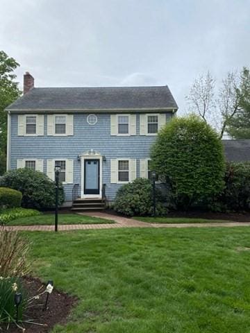19 Camelot Ct Unit 19, Stoughton, MA 02072 - colonial home with a chimney, a front yard, and entry steps