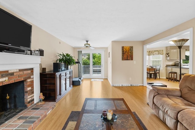 19 Camelot Ct Unit 19, Stoughton, MA 02072 - living room with wood finished floors, healthy amount of natural light, ceiling fan, and a fireplace