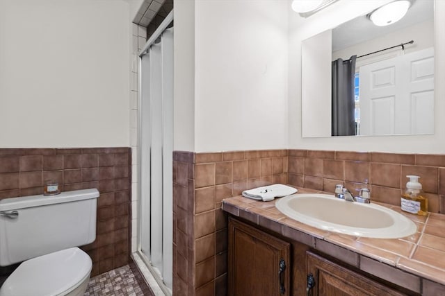 19 Camelot Ct Unit 19, Stoughton, MA 02072 - bathroom with tile walls, a shower stall, vanity, toilet, and wainscoting