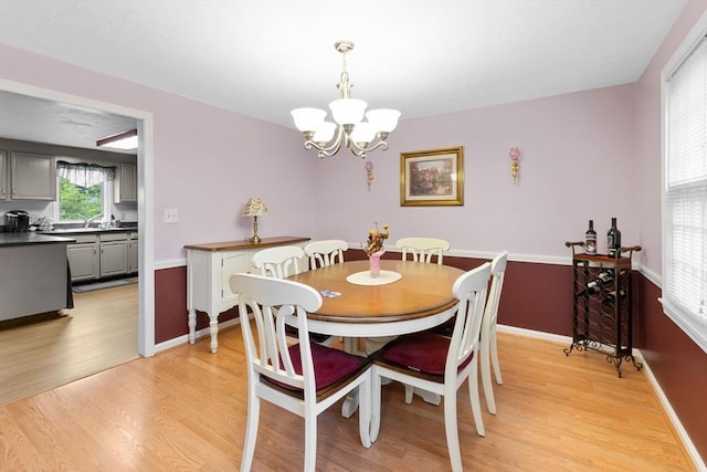 19 Camelot Ct Unit 19, Stoughton, MA 02072 - dining area featuring a chandelier, light wood-type flooring, and baseboards