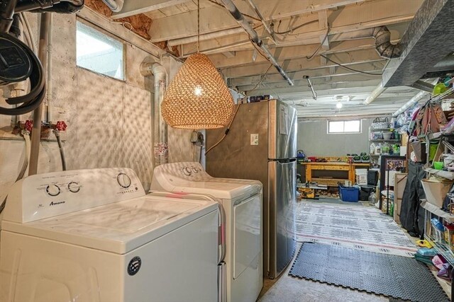 laundry room featuring washing machine and clothes dryer