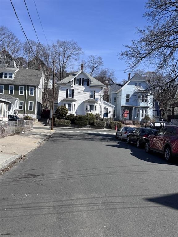 91 Tudor St, Chelsea, MA 02150 - view of asphalt street with a residential view, curbs, sidewalks, and traffic signs