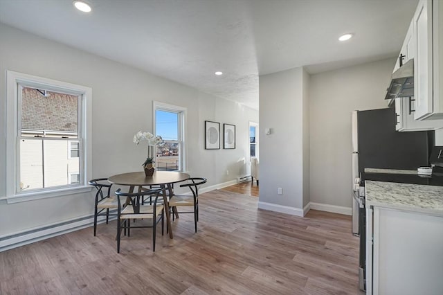 dining area featuring light wood-type flooring