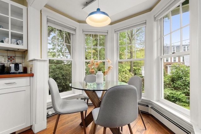 sunroom featuring baseboard heating