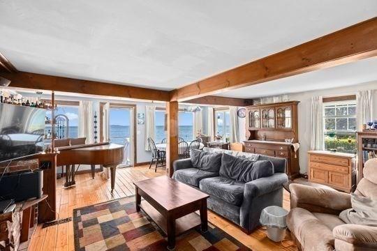 45 Rocky Nook Ave, Kingston, MA 02364 - living room featuring light wood-type flooring and beamed ceiling